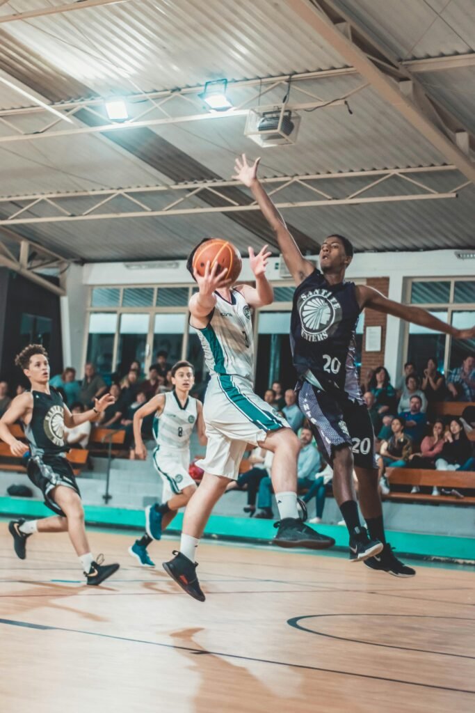 pexels-photo-2874717-2874717 Intense basketball match with players in action on an indoor court.